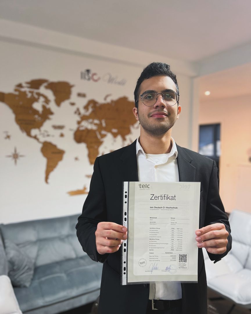 Student with a certificate of passing the exam after the preparatory courses in IISC